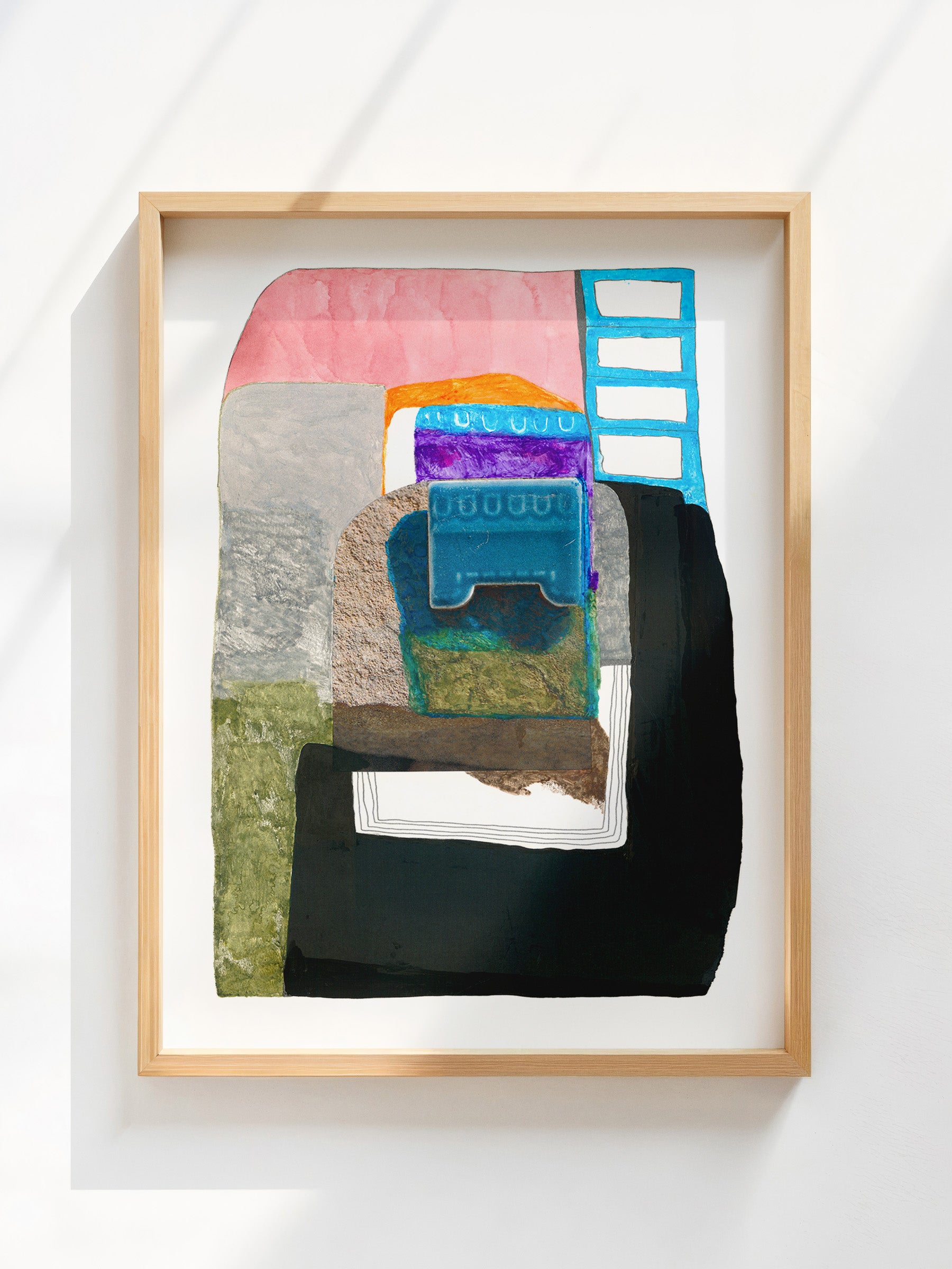 Framed abstract art piece with geometric shapes and vibrant colors on a white background