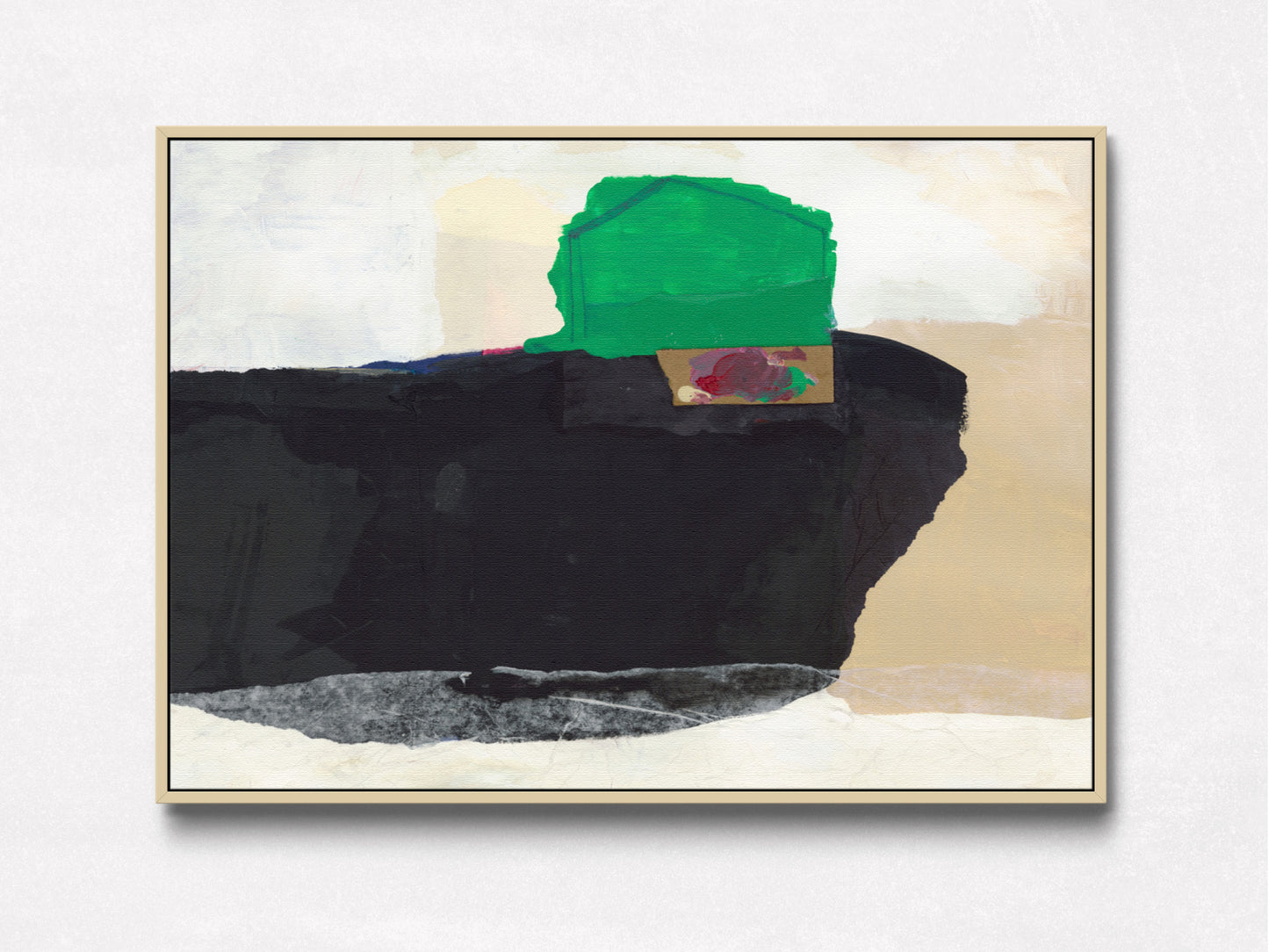 A framed abstract painting featuring a large black shape, a green block, beige and off-white areas, and a small red accent, displayed against a light textured wall.
