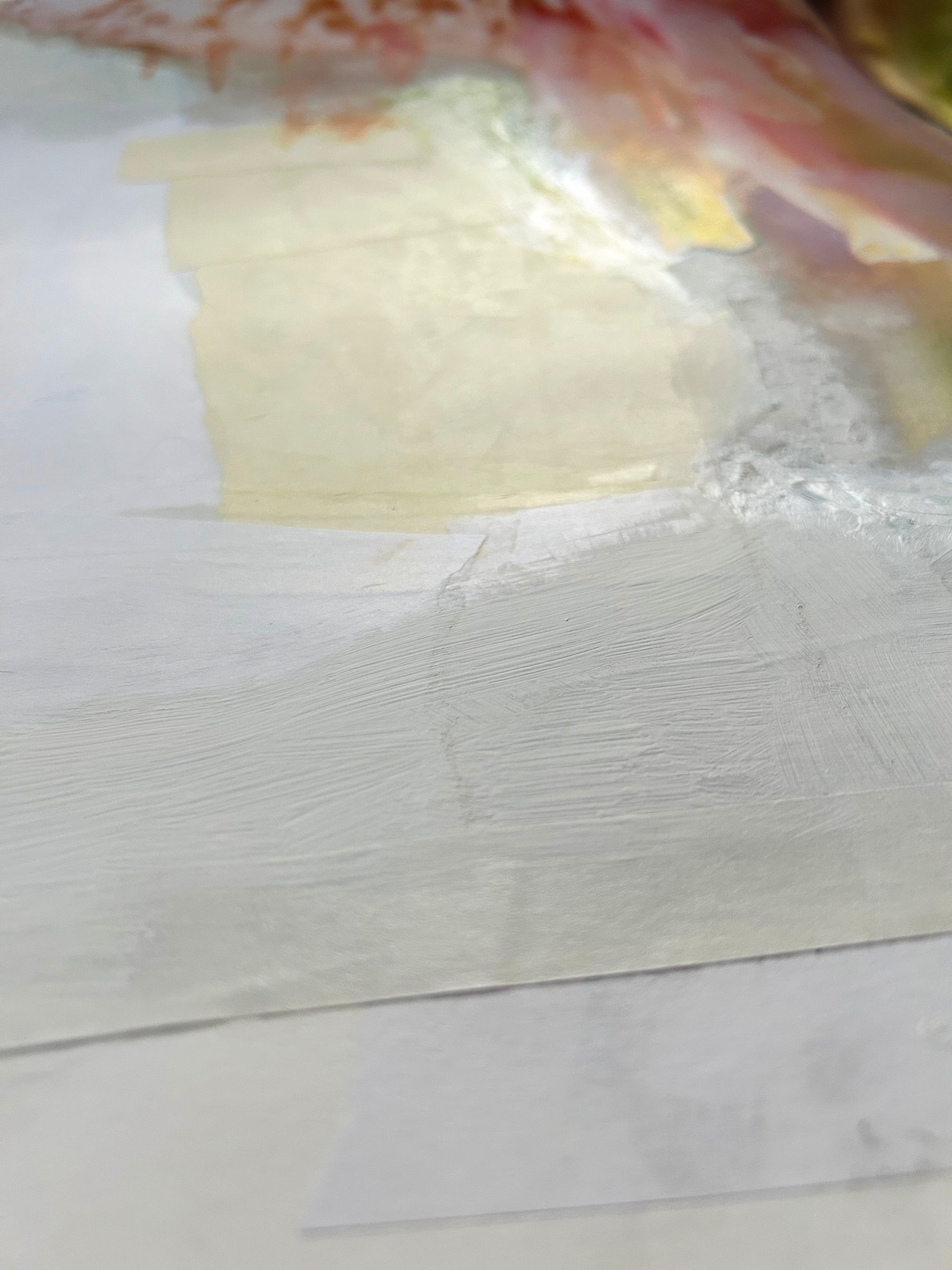 Closeup of a painting with lots of texture and light.