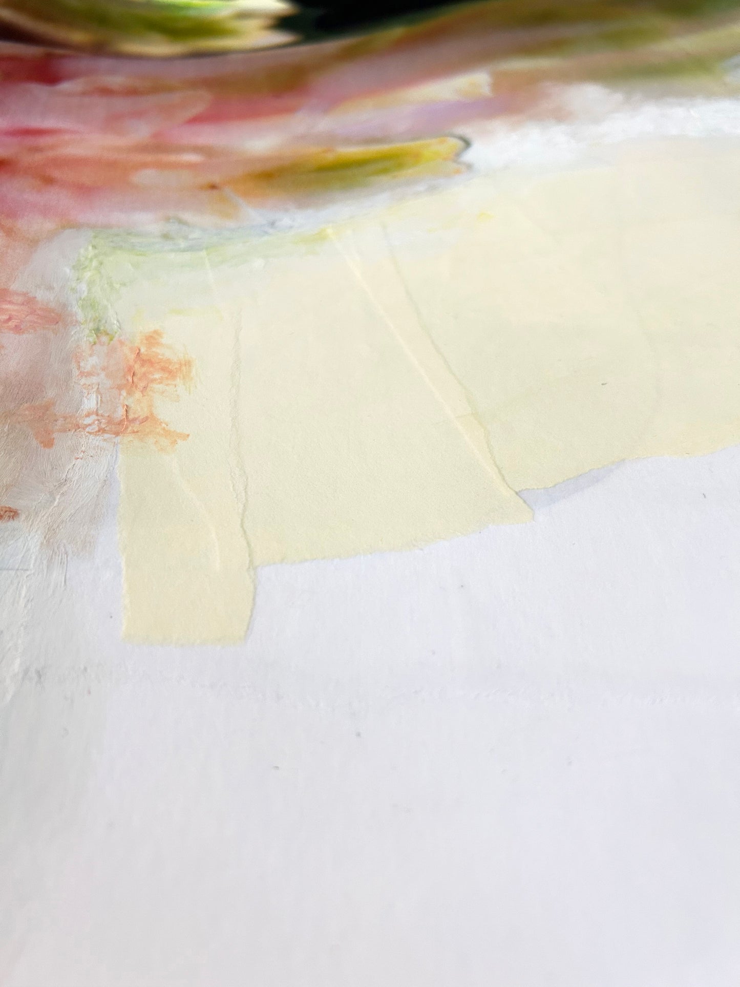 Close-up of a textured painting with a cream-colored patch and pink edges.