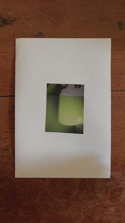 Abstract collage featuring two vertically stacked photographic fragments. The upper section shows a cropped, upside-down image of a woman on a green pillow with a red circular clock on a white wall above her head. The lower section displays a smooth gradient of green tones with soft lighting, creating a hazy, dreamlike effect.