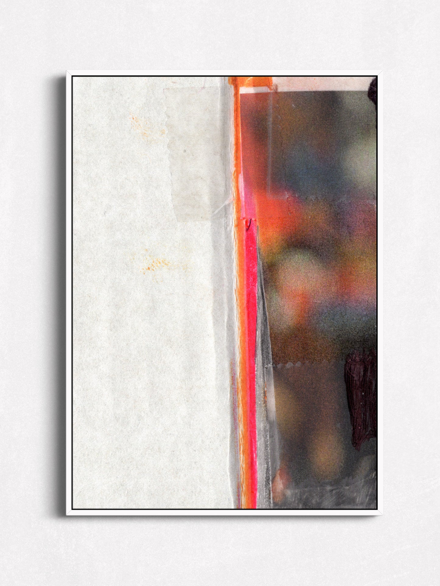 An abstract framed wall art print featuring a textured off-white left side, a narrow vertical red-orange stripe, and a dark, blurred multicolor right side, shown against a light gray wall.